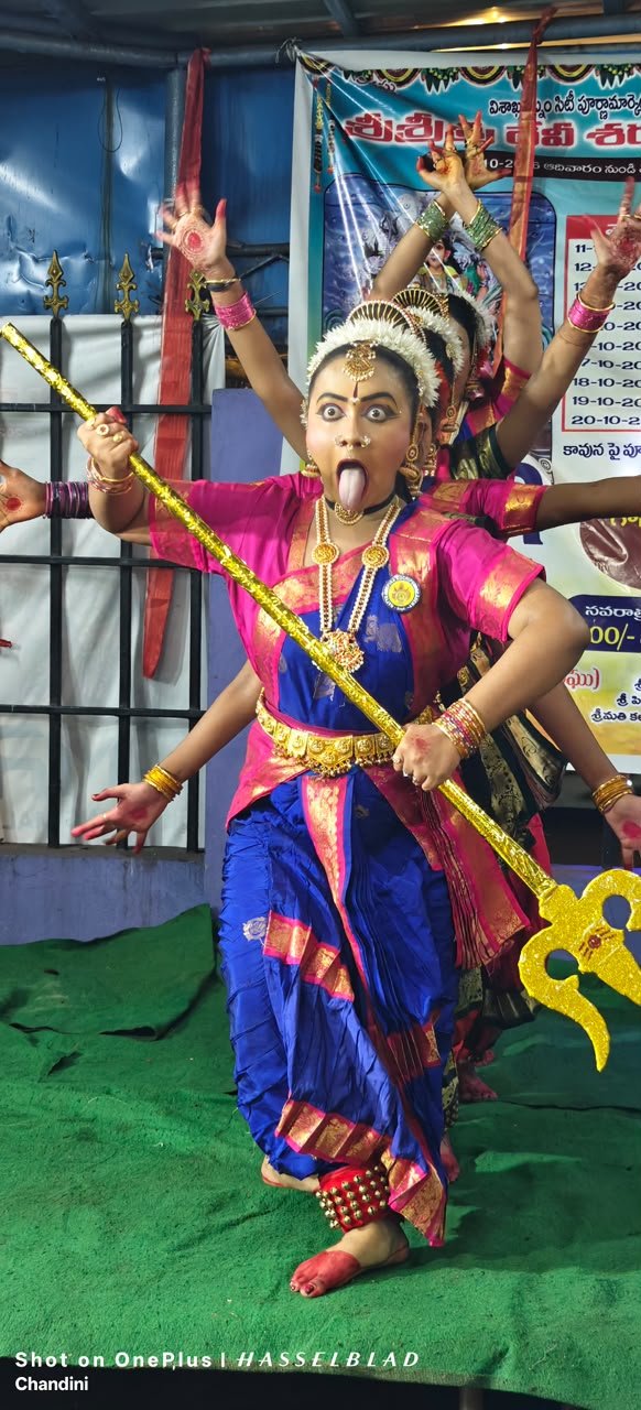 Kuchipudi dancer performing expressive Abhinaya with trident in Kali roopam